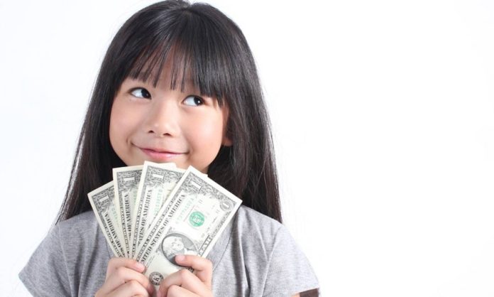 Ilustrasi Anak Memegang Uang (Foto: Istimewa)