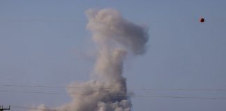 Gambar ini diambil dari posisi di perbatasan Israel dengan Jalur Gaza, menunjukkan asap mengepul di tengah pengeboman Israel ke Gaza pada Selasa (16/9/2025).(AFP/MENAHEM KAHANA)